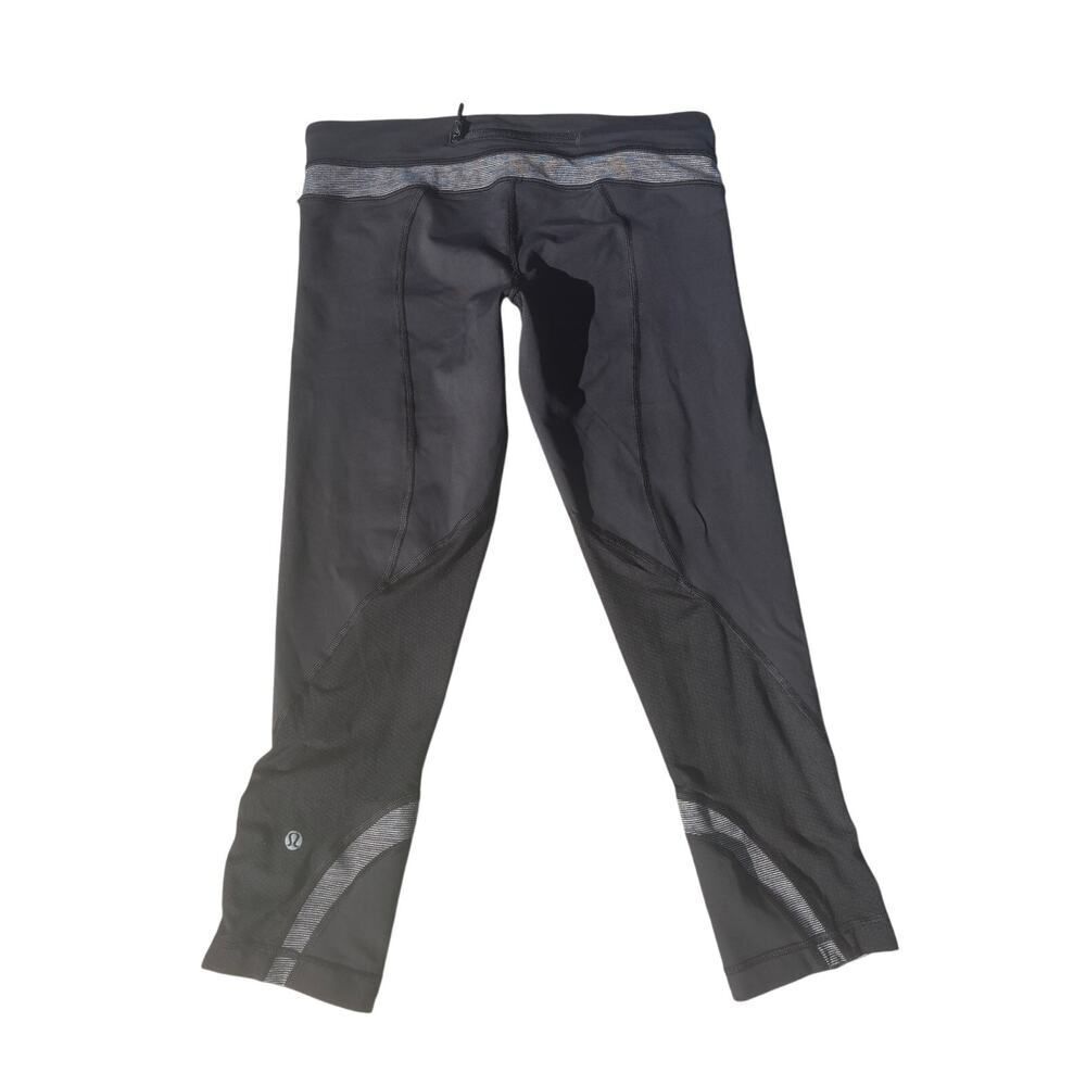 Lululemon Run: Inspire Crop II leggings with gray stripe pattern, size 8
